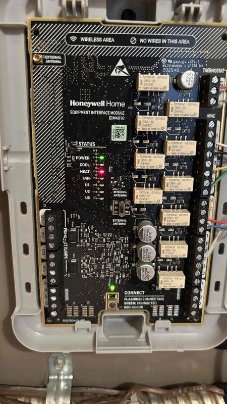 Installed Honeywell Home Elite Pro thermostat with EIM (Equipment Interface Module) model EIM007U. Completed all wiring terminations at thermostat base and interface module, verified proper connections at terminal blocks, and confirmed system power and communication status through LED indicators on the EIM board.