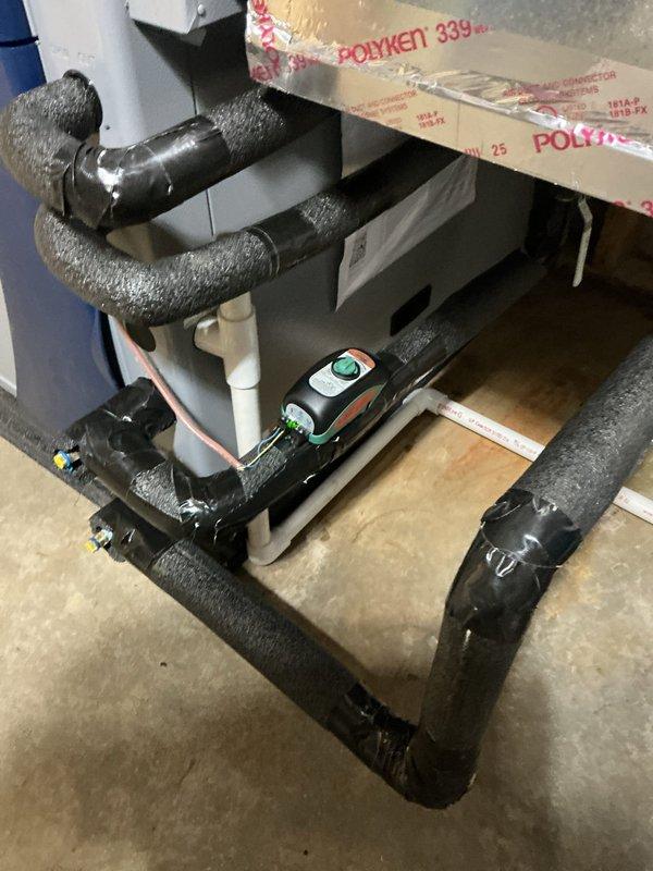 Completed installation of Waterfurnace W5AV036BD1A12NTR2B01 3-ton 2-stage variable speed 5 series geothermal heat pump system with IntelliStart technology and cupronickel water coil for enhanced mineral resistance. Installed EAL10 10KW internal electric backup heat, WWK2T well water kit with slow-closing solenoid valve to prevent water hammer, flow regulator, Honeywell 8000 digital programmable touchscreen thermostat, and I-WAVE R air purifier.

Repositioned unit 90 degrees to relocate return air intake from rear to right side for improved accessibility and airflow management. Connected unit to existing ductwork and performed necessary duct modifications to accommodate new orientation. Reconnected system to existing open-loop geothermal piping system and verified proper water flow rates. Reconnected desuperheater to existing water heater for domestic hot water heating efficiency. Completed all high and low voltage wiring connections to geothermal unit, thermostat, and system controls.
