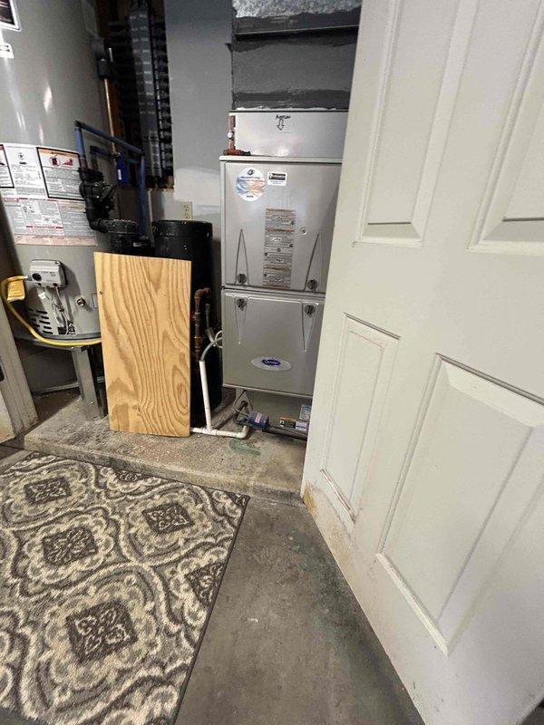 Completed estimate for replacement of existing Carrier furnace and air conditioning system located in garage closet. Evaluated inadequate heating and cooling performance affecting second floor areas, which has persisted since homeowner occupancy began approximately eighteen months ago. Assessed current HVAC equipment configuration, ductwork layout, and airflow distribution to identify causes of insufficient temperature control on upper level. Photographed existing Carrier furnace unit, associated ductwork, and mechanical room setup for documentation and system analysis. Discussed potential solutions to improve second floor climate control, including equipment replacement options and possible ductwork modifications to enhance air distribution. Customer also expressed interest in ductwork cleaning services to optimize system performance.