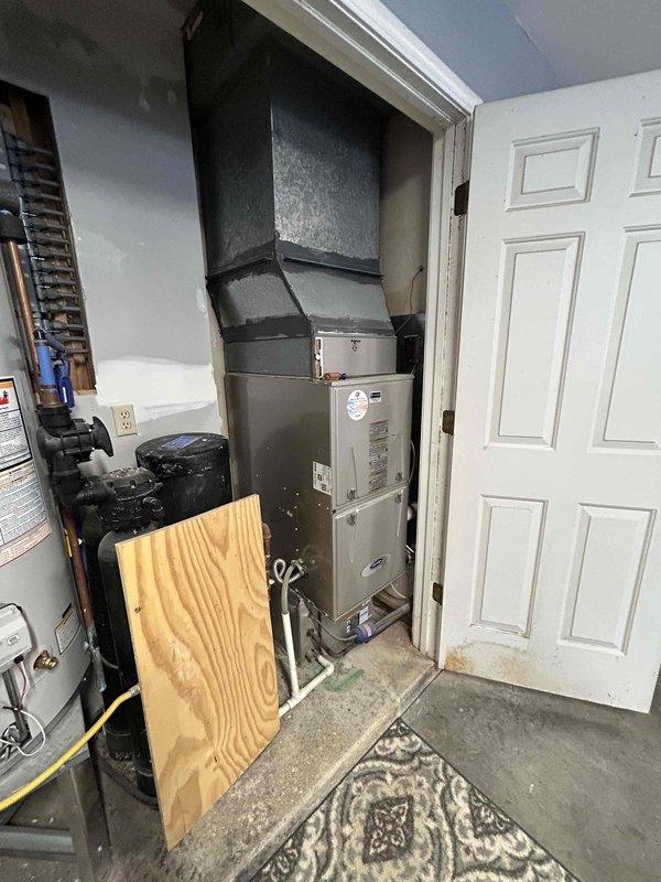 Completed estimate for replacement of existing Carrier furnace and air conditioning system located in garage closet. Evaluated inadequate heating and cooling performance affecting second floor areas, which has persisted since homeowner occupancy began approximately eighteen months ago. Assessed current HVAC equipment configuration, ductwork layout, and airflow distribution to identify causes of insufficient temperature control on upper level. Photographed existing Carrier furnace unit, associated ductwork, and mechanical room setup for documentation and system analysis. Discussed potential solutions to improve second floor climate control, including equipment replacement options and possible ductwork modifications to enhance air distribution. Customer also expressed interest in ductwork cleaning services to optimize system performance.
