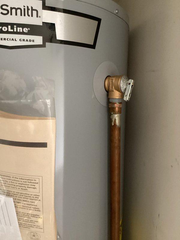 Responded to callback for leaking temperature and pressure relief valve on commercial-grade A.O. Smith ProLine water heater following previous day's maintenance service. Inspected relief valve discharge and confirmed slow leak from valve body. Replaced defective T&P relief valve with new unit, tested operation and discharge function, and verified proper seating with no leakage detected upon completion.