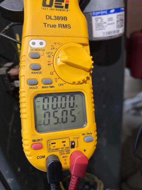 Completed comprehensive AC tune-up on residential cooling system. Upon inspection, discovered capacitor with severe rust deterioration on metal cap and corrosion buildup around terminal connections, though unit remained functional. Performed standard maintenance protocol including system performance testing, electrical measurements showing 95.05 voltage reading and 0.00 amp draw at time of testing, cleaned condenser coil, checked refrigerant levels, and verified proper system operation. System restored to optimal working condition with recommendations provided for future capacitor replacement due to advanced corrosion.