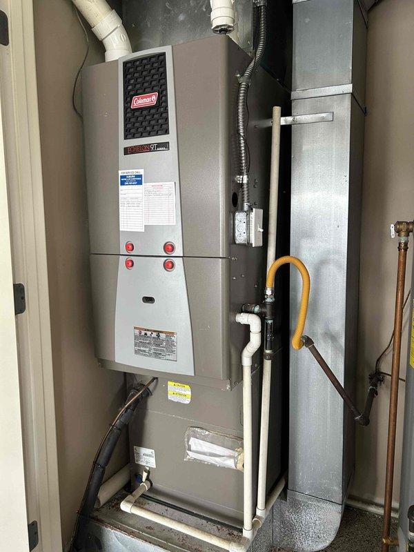 Responded to service call for non-operational furnace and provided replacement estimate for complete HVAC system. Assessed existing Coleman furnace and outdoor AC condenser unit, documented current equipment specifications and installation configuration including gas line connections, PVC venting, electrical disconnect, and ductwork setup. Generated comprehensive replacement estimate for new furnace and air conditioning system to restore heating and cooling capabilities to the residence.