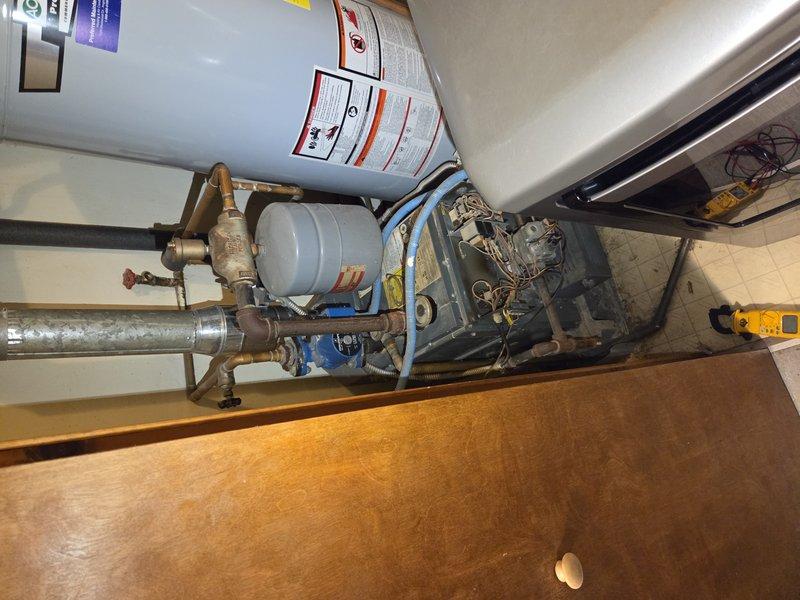 Responded to callback for pilot light outage on Teledyne Laars boiler, second occurrence within days raising concern for potential gas leak. Upon arrival, inspected boiler system, gas supply lines, and pilot assembly. Conducted combustion analysis and gas leak detection testing throughout system. Photographed equipment nameplate and mechanical room setup for documentation. Verified proper gas pressure, checked thermocouple operation, and tested safety controls. Relit pilot light after ensuring safe operating conditions and confirmed stable flame operation before departure.
