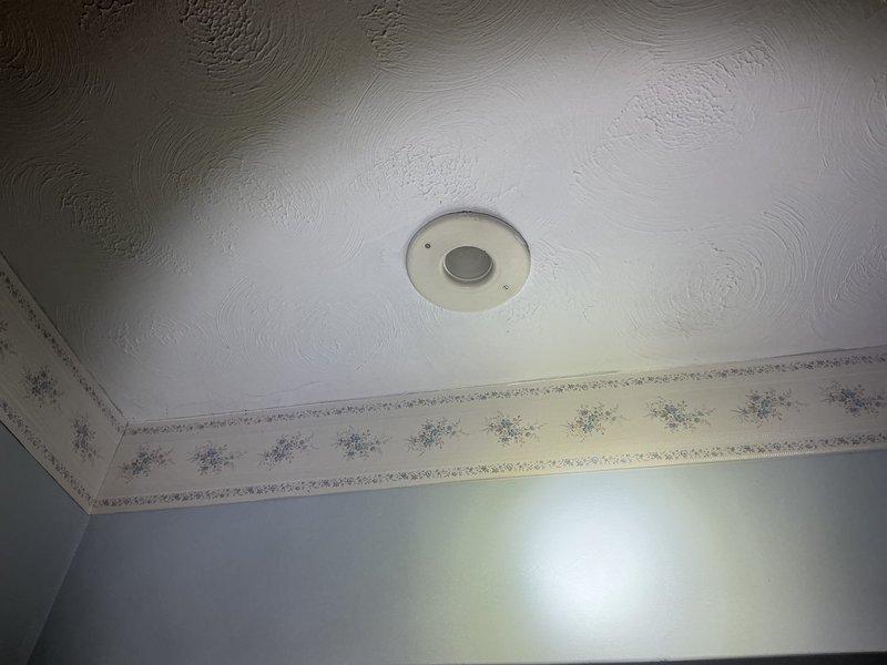 Conducted estimate for complete HVAC system replacement at residential property with existing 1960s-era forced air cooling system and baseboard heating. Assessed attic-mounted blower unit and evaluated current infrastructure for full system upgrade. Documented existing conditions including interior living spaces and basement utility areas where new equipment and ductwork modifications will be required.