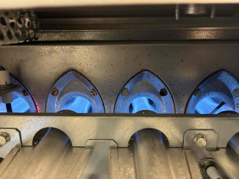 Performed second opinion inspection on gas furnace following previous contractor's diagnosis of cracked heat exchanger. Conducted comprehensive system evaluation including visual inspection of heat exchanger, burner operation analysis, and pressure differential testing using digital manometer which measured +32.38 InWg. Observed all three burner assemblies firing with proper blue flame characteristics and normal combustion patterns. Documented findings with photographic evidence of burner operation and diagnostic measurements for customer review. Coordinated with sales representative for equipment replacement consultation.