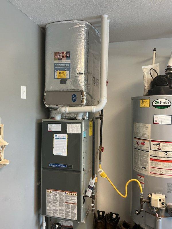 Performed second opinion evaluation of residential HVAC system following previous diagnosis of cracked heat exchanger. Conducted comprehensive inspection of gas furnace, air handler, and outdoor condensing unit to verify reported heat exchanger failure and identify any additional system deficiencies. Documented current equipment condition through photographic assessment of indoor heating components and outdoor AC unit. Provided detailed estimate for complete HVAC system replacement including new gas furnace and air conditioning equipment to address identified safety concerns and system failures.