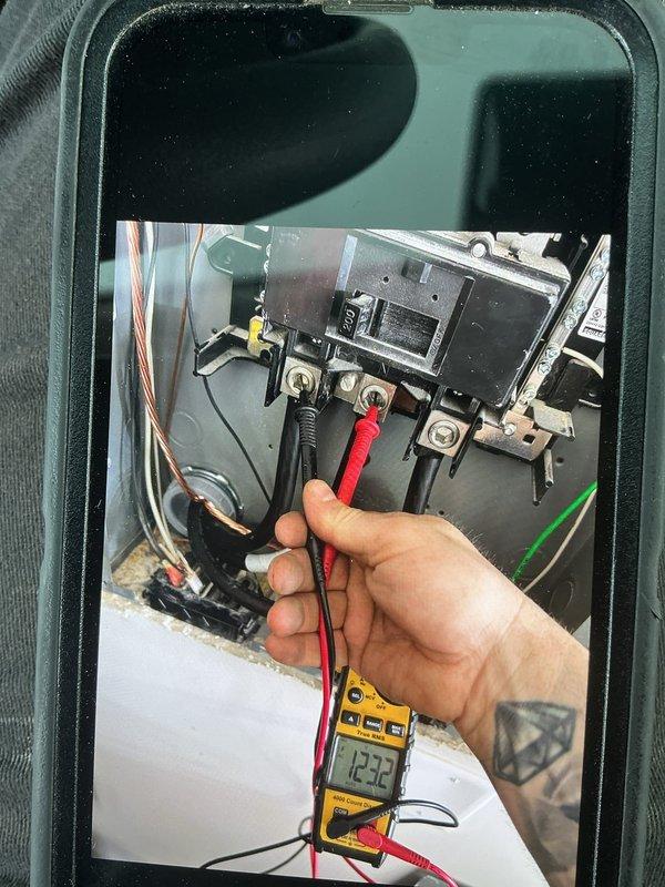 Completed installation of 10kW Generac standby generator system with full electrical integration. Mounted and wired transfer switch enclosure on exterior wall, establishing proper connections between utility service, generator, and home electrical panel. Installed all required circuit breakers, terminal blocks, and safety disconnects per manufacturer specifications and local electrical code. Ran and terminated all power conductors, including line, load, and neutral wiring with appropriate gauge copper wire. Performed voltage testing and verification, confirming proper 120V readings across circuits to ensure safe and reliable automatic transfer switch operation during power outages.