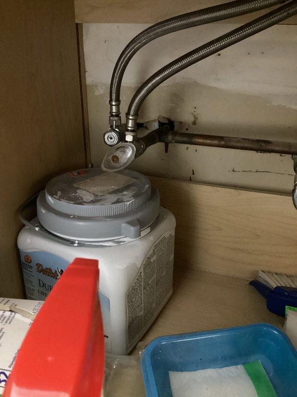 Responded to emergency call for bathroom faucet that would not shut off. Upon arrival, found that the shut-off valve at the base of the sink had broken during customer's attempt to stop water flow, resulting in active water leak. Successfully shut off water supply to the affected fixture to stop the leak. Assessed the damaged shut-off valve and surrounding plumbing connections under the sink. Documented existing conditions including P-trap assembly, supply line connections, and cabinet interior for repair planning. Secured the area and ensured no further water damage would occur.