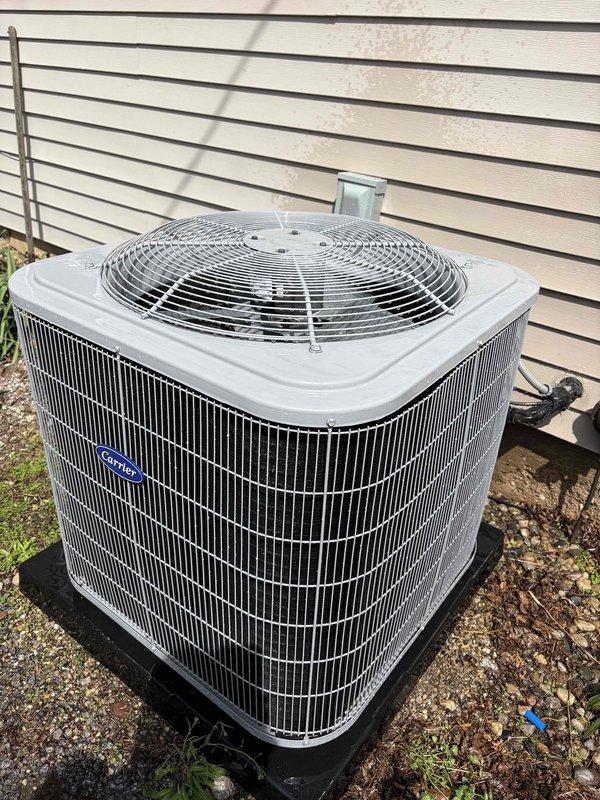 Completed first-time air conditioning maintenance on Carrier outdoor condenser unit. Performed comprehensive system inspection including examination of heat exchanger coils, fan assembly, and refrigerant lines. All components found to be in good operating condition with coils clean and properly functioning. Inspected compressor, motor assembly, and copper refrigerant piping which showed no signs of leaks or deterioration. Verified proper unit placement on mounting pad with adequate clearance for airflow. Fan guard and protective mesh screening intact and secure. Interior drain pan and associated components inspected and found clean with no blockages. System operational and ready for cooling season.