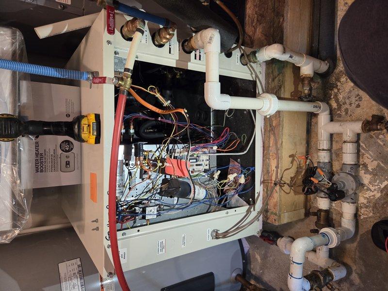 Responded to no cooling complaint on geothermal heat pump system located in basement. Upon arrival, unit was operational but customer reported insufficient cooling capacity. Performed diagnostic evaluation of geothermal system including inspection of internal components, electrical connections, control boards, and refrigerant line set. Checked system pressures and temperatures using digital meters to assess heat exchange performance. Verified proper operation of all safety controls, relays, and wiring connections within air handler cabinet. Inspected water-side connections including flow center valves and expansion tank for proper configuration. System found to be functioning within operational parameters at time of service call.