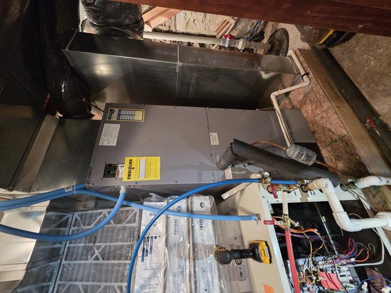 Responded to no cooling complaint on geothermal heat pump system located in basement. Upon arrival, unit was operational but customer reported insufficient cooling capacity. Performed diagnostic evaluation of geothermal system including inspection of internal components, electrical connections, control boards, and refrigerant line set. Checked system pressures and temperatures using digital meters to assess heat exchange performance. Verified proper operation of all safety controls, relays, and wiring connections within air handler cabinet. Inspected water-side connections including flow center valves and expansion tank for proper configuration. System found to be functioning within operational parameters at time of service call.