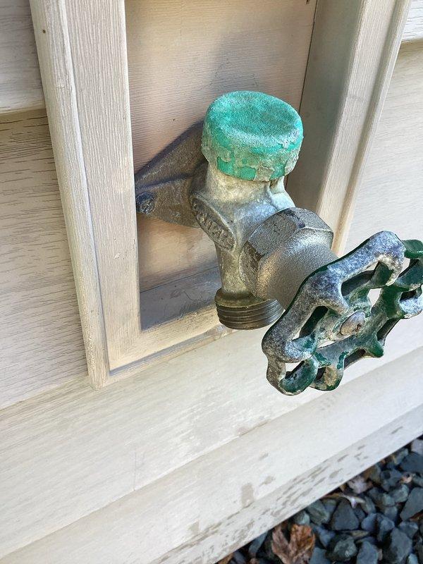 Responded to water leak complaint involving two exterior freeze-proof spigots. Upon inspection, found significant corrosion and oxidation on both hose bibs, with visible turquoise-green patina indicating advanced deterioration of brass components. Assessed valve bodies, handles, and spout assemblies for leak sources. Documented existing conditions showing weathered fixtures with compromised sealing surfaces due to mineral buildup and metal degradation. Evaluated whether rebuild kits would provide adequate repair solution versus full fixture replacement given extent of corrosion observed on valve stems and bonnets.