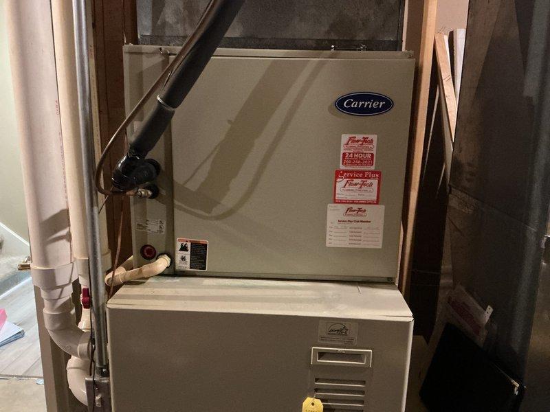 Completed on-site assessment of existing Carrier furnace and air conditioning system for full HVAC replacement estimate. Evaluated current equipment condition, ductwork configuration, and installation environment in basement utility area. Documented existing system specifications, venting arrangements including PVC condensate lines, and spatial requirements for new equipment installation. Provided comprehensive replacement options and recommendations to customer who is comparing multiple contractor proposals.