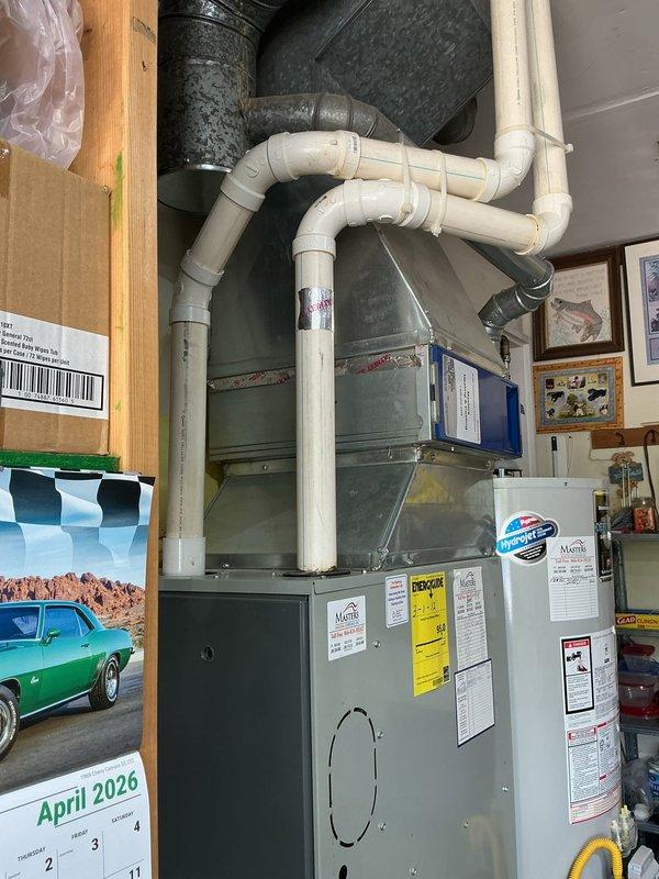 Responded to no-cooling complaint on 15-year-old residential HVAC system. Diagnostic inspection revealed leaking evaporator coil and failed thermostatic expansion valve (TXV). Due to age of equipment and extent of necessary repairs, provided comprehensive replacement estimate as alternative to repair quote. Documented existing furnace and air handler installation in basement mechanical room with photographs showing current system configuration, including PVC condensate drainage and ductwork connections. Coordinated with team regarding repair versus replacement options for customer consideration. Estimate includes new maintenance plan enrollment as requested.