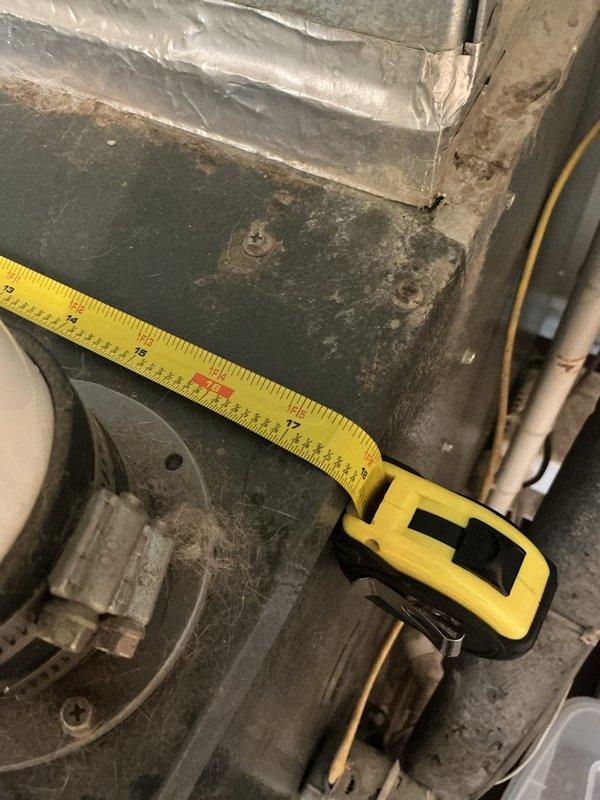 Conducted on-site evaluation of existing HVAC system in residential utility room for complete furnace and air conditioning replacement estimate. Assessed current equipment including aging furnace unit with visible wear, dust accumulation, and operational degradation, along with existing ductwork configuration and water heater placement. Documented equipment specifications, measured clearances, photographed existing installation including furnace nameplate data and spatial constraints, and evaluated electrical service, gas line connections, and ventilation requirements to provide comprehensive replacement system recommendations.