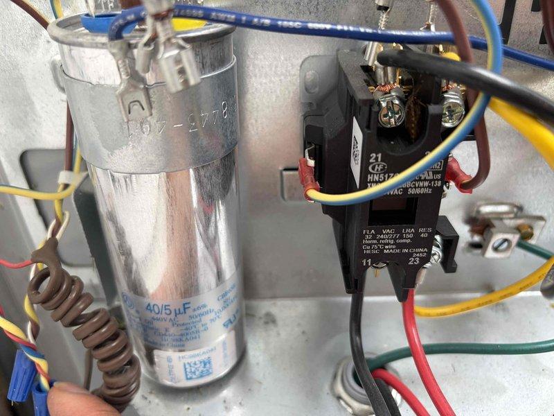Completed prepaid cooling system maintenance and inspection on residential air conditioning unit. Performed comprehensive system evaluation including electrical component testing using digital multimeter to verify proper voltage and amperage readings. Inspected and tested dual-run capacitor (40/5 μF) and contactor relay, confirming all electrical connections were secure and components operating within manufacturer specifications. All wiring connections examined for proper termination and no signs of overheating or degradation noted. System found to be functioning properly with no repairs required at this time.