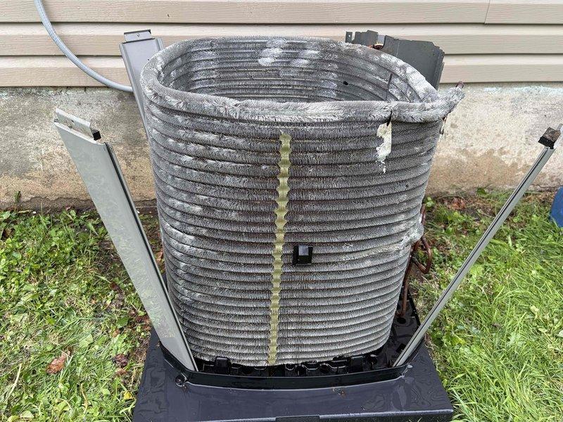 Performed comprehensive air conditioning tune-up service on outdoor condensing unit. Inspected and cleaned evaporator coil which showed significant dust and debris accumulation on fin surfaces; verified proper electrical connections at terminal blocks with all wiring secure and intact. System operational and ready for cooling season.