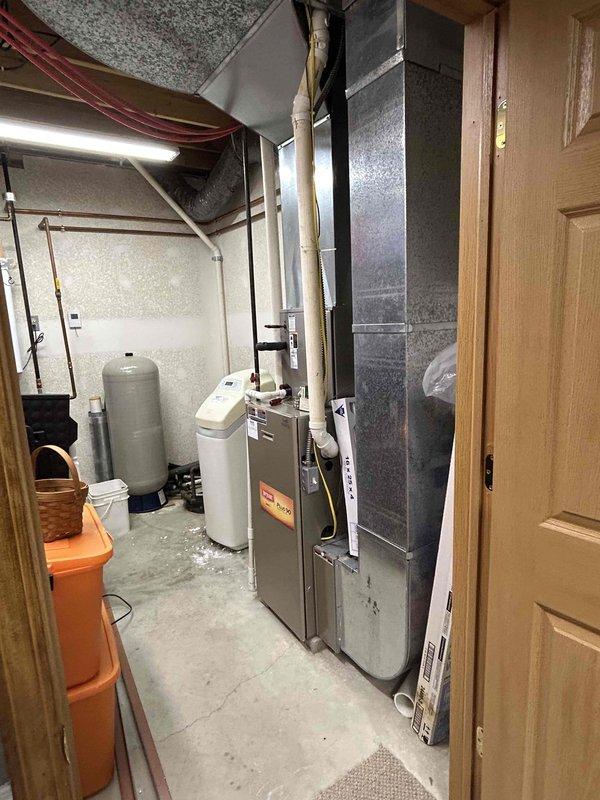 Conducted comprehensive assessment of existing Bryant HVAC system in basement utility room to provide replacement estimates. Evaluated current furnace and air conditioning equipment, documenting system configuration, installation layout, ductwork connections, and clearances. Presented multiple replacement options including combined AC and furnace package as well as individual unit replacement scenarios, discussing available financing programs with homeowner. Photographed existing equipment and mechanical room setup for accurate proposal preparation.
