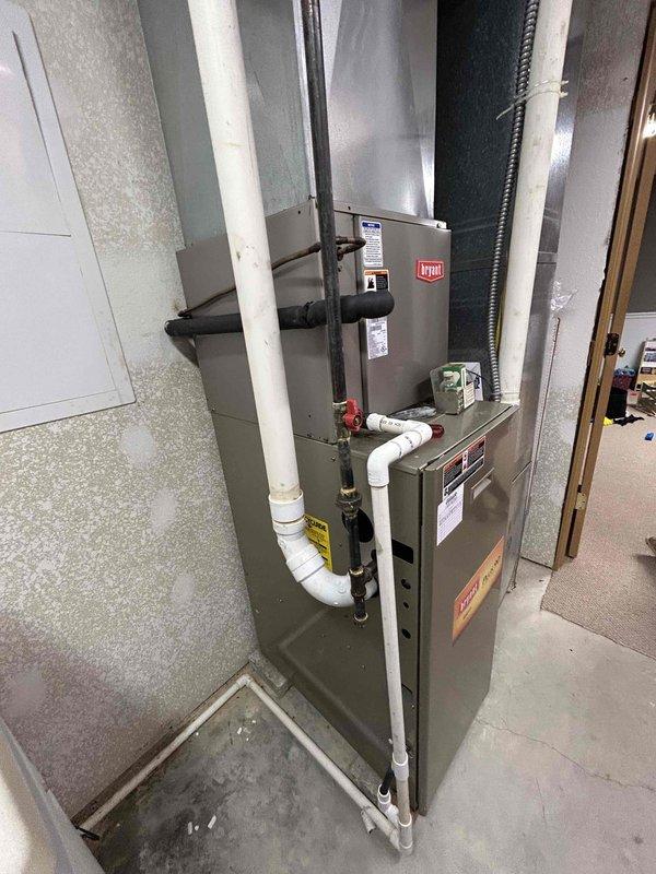 Conducted comprehensive assessment of existing Bryant HVAC system in basement utility room to provide replacement estimates. Evaluated current furnace and air conditioning equipment, documenting system configuration, installation layout, ductwork connections, and clearances. Presented multiple replacement options including combined AC and furnace package as well as individual unit replacement scenarios, discussing available financing programs with homeowner. Photographed existing equipment and mechanical room setup for accurate proposal preparation.