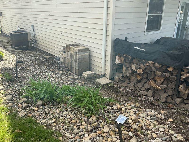 Conducted site evaluation for gas line extension to fireplace located on opposite side of residence from existing gas service. Assessed routing challenges due to slab foundation construction, requiring exterior gas line installation around perimeter of home. Documented existing HVAC equipment location, utility room configuration, and exterior access points to determine optimal gas line path and connection points for fireplace installation estimate.