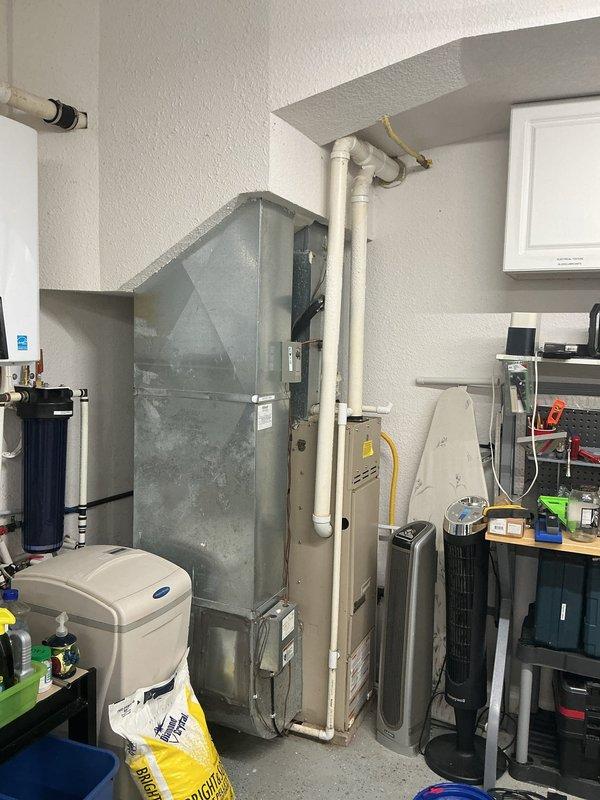 Conducted site evaluation for gas line extension to fireplace located on opposite side of residence from existing gas service. Assessed routing challenges due to slab foundation construction, requiring exterior gas line installation around perimeter of home. Documented existing HVAC equipment location, utility room configuration, and exterior access points to determine optimal gas line path and connection points for fireplace installation estimate.