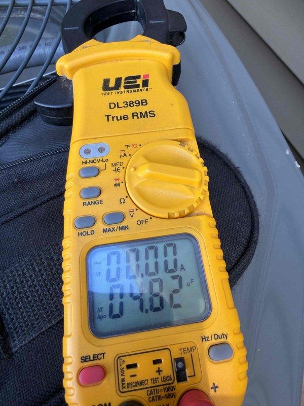 Completed first prepaid cooling season maintenance visit on residential HVAC system. Performed comprehensive inspection of outdoor condensing unit, accessing internal components to verify proper operation of capacitor, compressor, electrical connections, and control relays. Measured system temperature at 79.8°F and confirmed all electrical components within normal operating parameters, with wiring harnesses and connections secure throughout the unit.