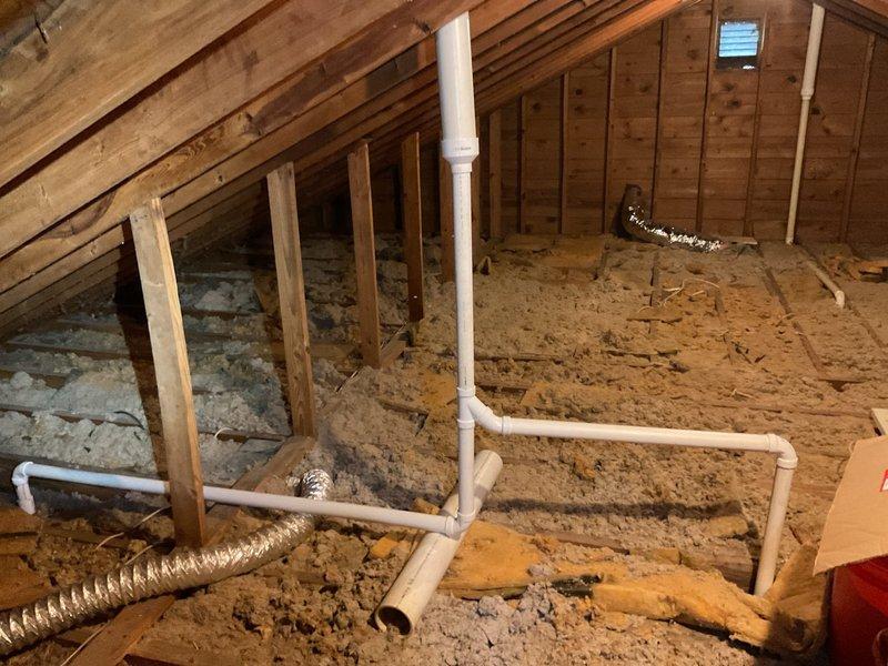 Replaced compromised bathroom exhaust fan vent pipe and rerouted plumbing stack vents in attic that were damaged during previous roof installation. Installed 20 feet of 3" PVC pipe with necessary fittings including couplings, 90-degree elbows, and reducers to properly redirect ventilation and plumbing vents. All vent stacks now properly configured and secured within attic space to ensure adequate airflow and code compliance.
