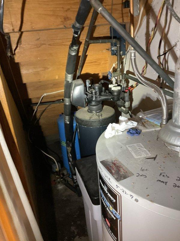 Performed comprehensive tanked water heater maintenance flush on dual water heater system installed in basement utility area. Drained sediment and mineral buildup from both tanks through drain valves to improve heating efficiency and extend equipment lifespan. Inspected all plumbing connections, including copper supply lines, shut-off valves, pressure relief valves, and flexible connectors for proper operation and signs of corrosion or wear. Verified pressure tank functionality and checked all brass fittings for leaks. Refilled water heaters and tested for proper operation following flush procedure. All components functioning within normal parameters upon completion.