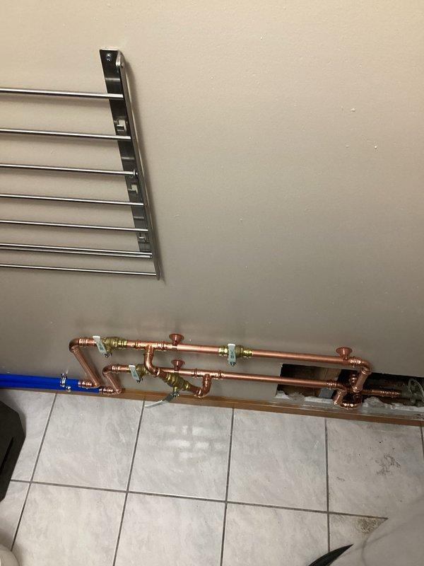 Completed installation and hook-up of water softener and water heater system, coordinating with city utilities for proper connection and inspection. Installed new copper supply piping with appropriate fittings, shut-off valves, and connections to integrate both units into the existing plumbing infrastructure. All work was scheduled as first appointment to accommodate required city coordination and ensure proper system activation.