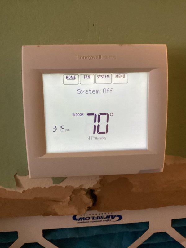Completed full HVAC system replacement including installation of Carrier 26SPA624W003 single-stage air conditioner with 2.5-ton capacity, Carrier CVAVA3017XMA evaporator coil, and Carrier 59TP7A060V17-16 Performance 97 two-stage gas furnace with 60,000 BTU input. Installed Honeywell VisionPRO TH8321R1001 programmable thermostat and provided operational instruction to homeowner. Removed and properly disposed of existing HVAC equipment per environmental regulations. Reconnected all existing supply and return ductwork to new system, installed new electrical disconnect and whip for outdoor condenser unit, and mounted condenser on level pad against exterior wall. Registered all equipment warranties with manufacturer within required timeframe. Performed complete system startup, verified proper refrigerant charge, tested gas furnace ignition and flame sensor operation, confirmed adequate airflow across evaporator coil, and checked all electrical connections for proper voltage and amperage. Se