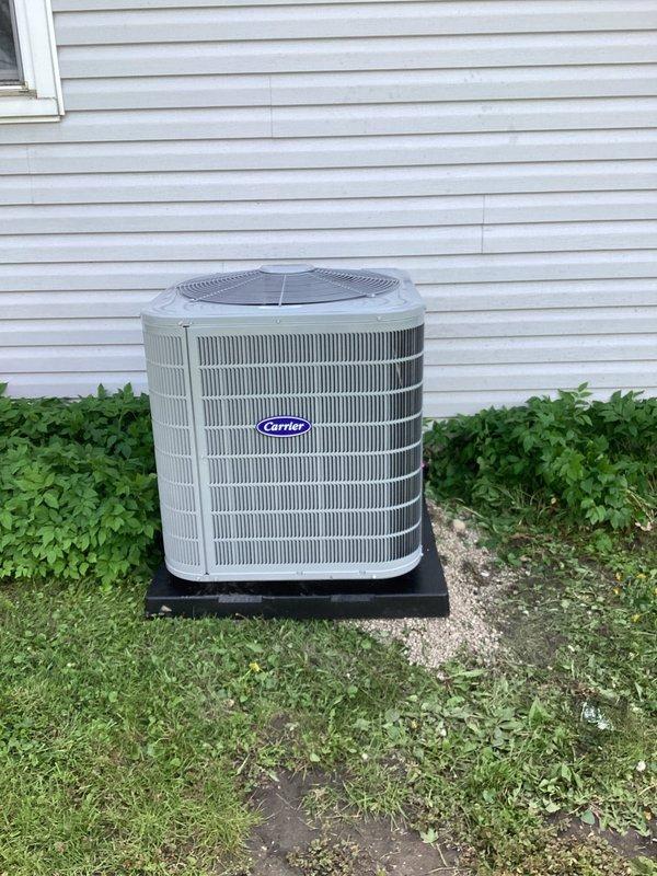 Completed full HVAC system replacement including installation of Carrier 26SPA624W003 single-stage air conditioner with 2.5-ton capacity, Carrier CVAVA3017XMA evaporator coil, and Carrier 59TP7A060V17-16 Performance 97 two-stage gas furnace with 60,000 BTU input. Installed Honeywell VisionPRO TH8321R1001 programmable thermostat and provided operational instruction to homeowner. Removed and properly disposed of existing HVAC equipment per environmental regulations. Reconnected all existing supply and return ductwork to new system, installed new electrical disconnect and whip for outdoor condenser unit, and mounted condenser on level pad against exterior wall. Registered all equipment warranties with manufacturer within required timeframe. Performed complete system startup, verified proper refrigerant charge, tested gas furnace ignition and flame sensor operation, confirmed adequate airflow across evaporator coil, and checked all electrical connections for proper voltage and amperage. Se