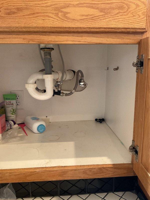 Installed Grundfos recirculation pump with comfort valve at water heater to address extended hot water delivery time to master bathroom lavatories. Mounted pump assembly on top of water heater tank with appropriate copper and flexible connector piping, installed digital control unit, and positioned comfort valve under master bathroom sink cabinet. System tested and operational, significantly reducing wait time for hot water delivery to fixtures.