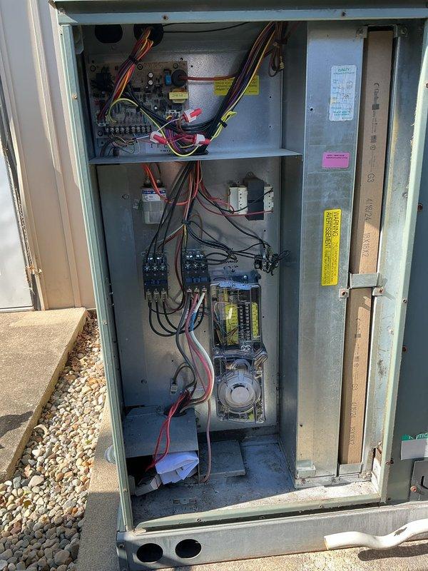 Installed two duct detectors in rooftop unit (RTU) electrical control panels to meet fire marshal compliance requirements. Connected detectors to existing alarm circuits with proper wiring terminations and verified operational functionality of both smoke detection devices upon completion.