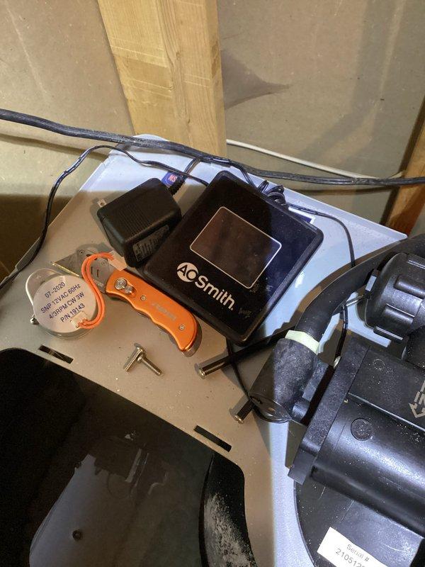 Completed installation of warranty replacement motor assembly on AO Smith water softener system. The original motor's gear drive had failed, causing the unit to remain stuck in fill position and preventing proper cycling back to home position. Replaced the defective motor assembly with customer-provided warranty part, reconnected all electrical connections and plumbing lines, and verified proper system operation through complete regeneration cycle. Unit now cycles correctly through all positions and returns to home position as designed.