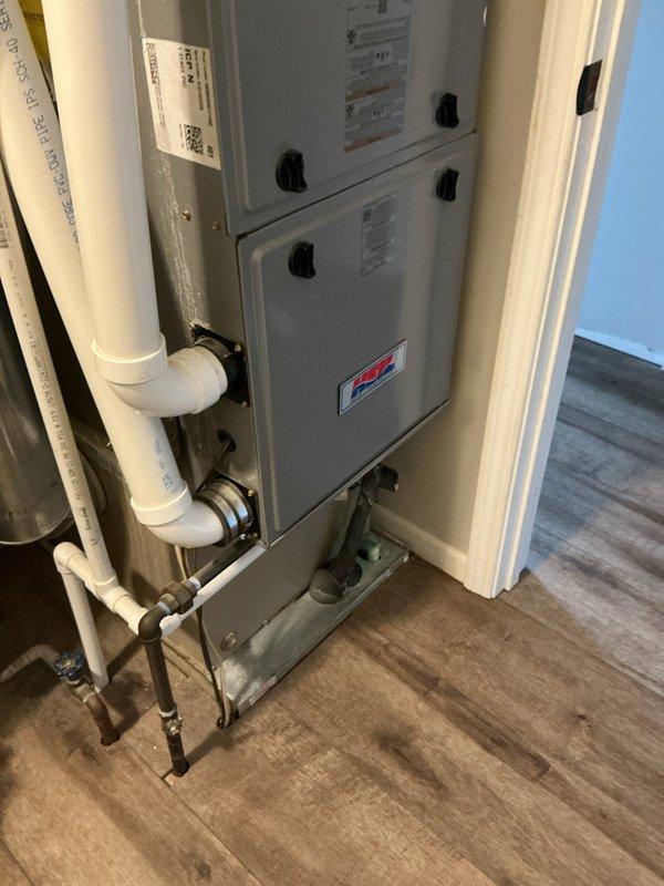 Conducted on-site assessment of existing residential HVAC system for air conditioning unit replacement estimate. Evaluated current equipment configuration including furnace, ductwork, humidifier, and associated components within utility closet installation. Documented system layout, existing infrastructure, and mechanical room dimensions through photographic documentation to determine replacement specifications and compatibility requirements for new AC unit installation.