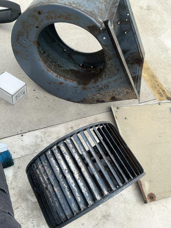 Performed comprehensive commercial HVAC tune-up including thorough blower assembly cleaning to remove accumulated dust and debris, applied evaporator coil cleaner to restore heat transfer efficiency, and replaced worn contactor to ensure reliable compressor operation. System components showed significant corrosion and weathering consistent with outdoor installation, requiring disassembly of blower housing and spiral scroll for proper access and cleaning. Unit restored to optimal operating condition with all components reassembled and tested for proper function.