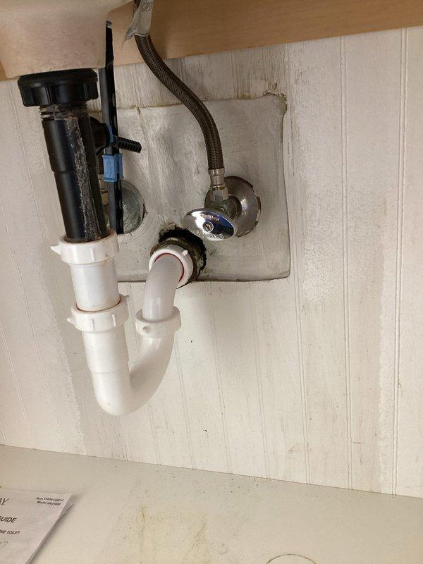 Responded to a leak originating from an upstairs bathroom sink that had caused water damage to the ceiling below, as identified during a buyer's home inspection. Performed diagnostic inspection of the affected area, accessing the ceiling cavity to assess the extent of water infiltration and identify the source of the leak. Examined under-sink plumbing assembly including P-trap, supply lines, garbage disposal connections, and shut-off valves to determine the point of failure. Documented existing conditions through photographic evidence showing ceiling damage, structural framing exposure, and complete under-sink plumbing configuration for repair assessment and insurance documentation purposes.