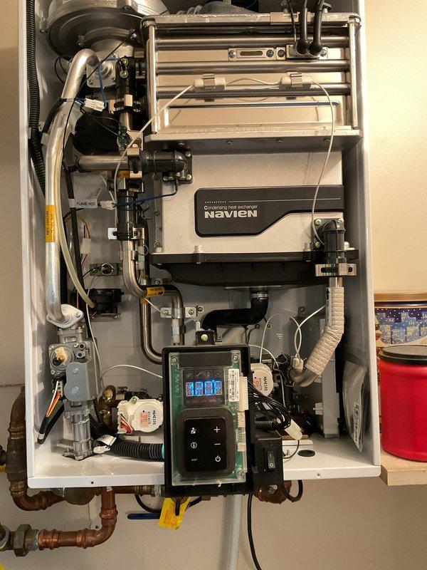 Performed maintenance flush on Navien NPE-240S tankless water heater unit. Accessed internal components, connected diagnostic equipment to monitor system parameters, and completed descaling flush procedure to remove mineral buildup from heat exchanger. Unit tested and operating within normal parameters upon completion.