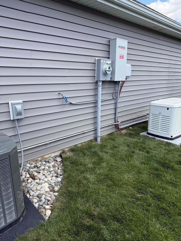 Installed natural gas supply line from existing gas meter to new standby generator unit. Routed black iron pipe along exterior wall of residence, secured with appropriate hangers and supports per code requirements. Connected gas line to generator inlet with approved fittings and performed pressure test to verify system integrity and leak-free operation.