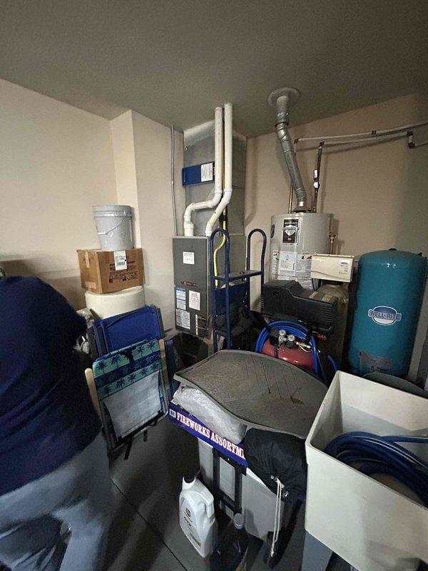 Conducted on-site evaluation of existing 25-year-old gas furnace and heat pump system to provide replacement estimate. Documented current equipment conditions, including furnace with PVC venting and gas line connections, along with existing heat pump unit. Assessed mechanical room layout and existing infrastructure to determine replacement requirements and compatibility for new HVAC system installation.