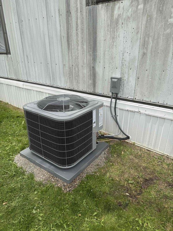 Completed full HVAC system installation including Carrier Comfort Series 26SCA436N003 single-stage air conditioner and Carrier CVAVA4217XMA evaporator coil. Installed outdoor condenser unit on new 2-inch PVC pad with proper gravel base and connected to existing 30-amp electrical circuit. Mounted new electrical disconnect box and whip on exterior wall with conduit running to unit. Indoor evaporator coil installed in utility closet with proper drainage connections and PVC piping configured for condensate removal.

Ran new refrigerant line set between outdoor condenser and indoor coil, ensuring proper insulation and routing through building structure. Completed all refrigerant connections, pressure testing, evacuation, and charging procedures to manufacturer specifications. Verified electrical connections at both indoor and outdoor units for proper voltage and amperage draw.

Installed floor protection in work areas and maintained clean workspace throughout installation. Completed system 