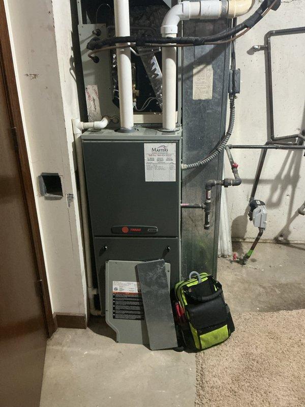 Responded to service call for leaking evaporator coil in residential air conditioning system. Upon inspection, identified coil leak requiring full system replacement. System had previous TXV replacement within past year that has failed again, indicating underlying system issues. Documented existing Trane furnace installation and outdoor condenser unit condition through photographs. Prepared comprehensive replacement estimate for new HVAC system with pricing considerations for recent repair history. Coordinated with management regarding equipment specifications and proposal details prior to customer presentation.
