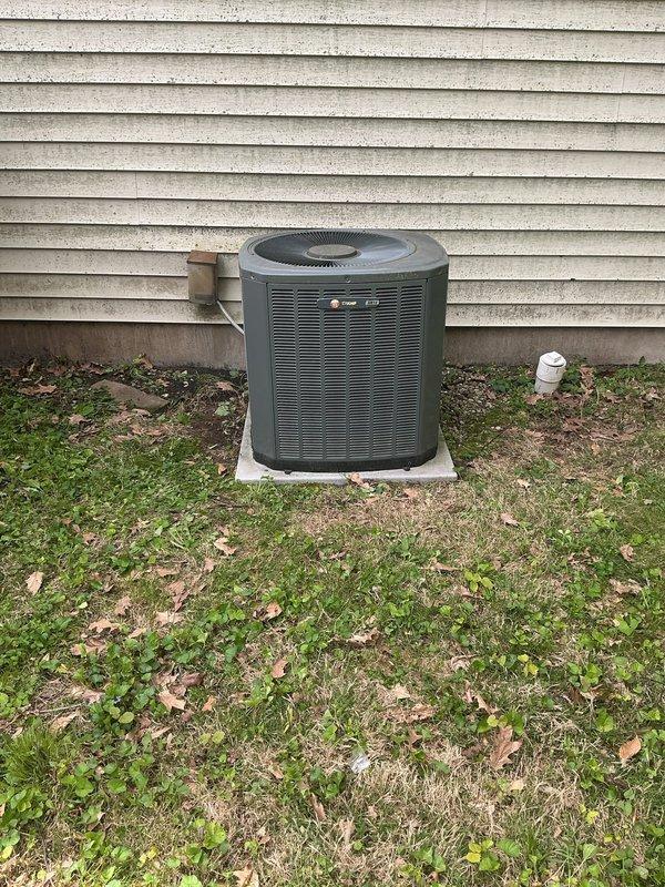 Responded to service call for leaking evaporator coil in residential air conditioning system. Upon inspection, identified coil leak requiring full system replacement. System had previous TXV replacement within past year that has failed again, indicating underlying system issues. Documented existing Trane furnace installation and outdoor condenser unit condition through photographs. Prepared comprehensive replacement estimate for new HVAC system with pricing considerations for recent repair history. Coordinated with management regarding equipment specifications and proposal details prior to customer presentation.
