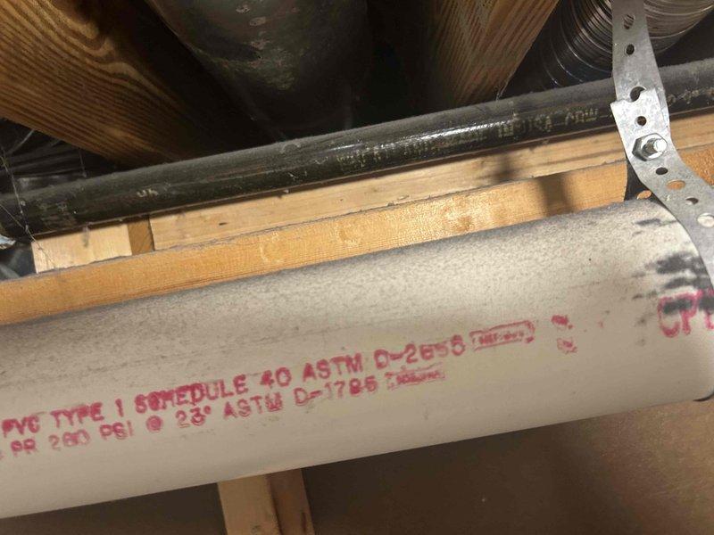 Conducted comprehensive site assessment for HVAC system replacement under technical supervision. Documented existing equipment configuration including ceiling-mounted air handler unit and associated condensate drainage system utilizing PVC Schedule 40 piping in attic space. Photographed current installation conditions, mechanical components, and utility routing to support replacement estimate and equipment specifications.