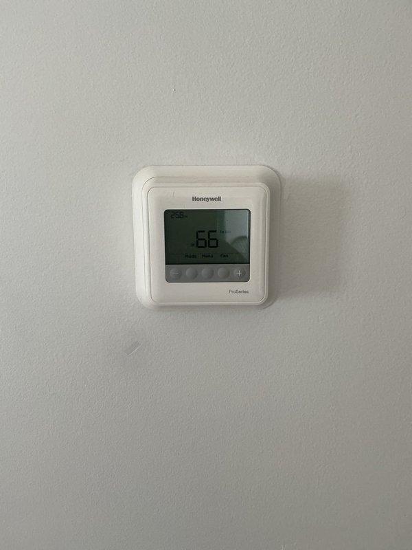 Completed on-site evaluation for adding air conditioning system to existing heating-only setup. Assessed current YORK furnace installation in basement and existing ductwork configuration to determine compatibility and requirements for AC integration. Documented existing equipment specifications and thermostat setup to provide comprehensive estimate for central air conditioning addition.