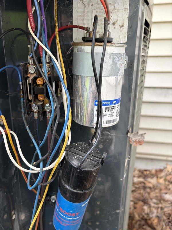 Completed first prepaid cooling maintenance visit on residential HVAC system. Performed comprehensive inspection of outdoor condensing unit, accessing electrical compartment to examine all internal components. Tested dual-run capacitor using digital multimeter, confirming capacitance readings within manufacturer specifications at 5.03 microfarads. Inspected all electrical connections, contactor assembly, and wiring harness for proper operation and signs of wear. Verified all copper refrigerant lines and connections for integrity. System operational and running efficiently upon completion of maintenance service.