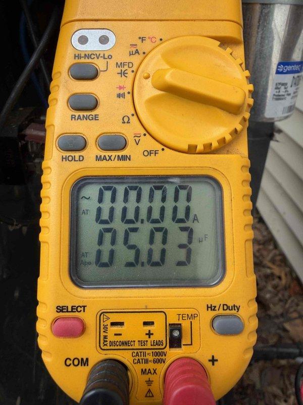 Completed first prepaid cooling maintenance visit on residential HVAC system. Performed comprehensive inspection of outdoor condensing unit, accessing electrical compartment to examine all internal components. Tested dual-run capacitor using digital multimeter, confirming capacitance readings within manufacturer specifications at 5.03 microfarads. Inspected all electrical connections, contactor assembly, and wiring harness for proper operation and signs of wear. Verified all copper refrigerant lines and connections for integrity. System operational and running efficiently upon completion of maintenance service.