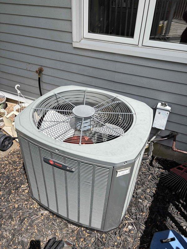 Completed first prepaid cooling season maintenance visit on residential air conditioning system. Performed comprehensive inspection of outdoor condensing unit including visual assessment of cabinet condition, electrical connections, and capacitor. Verified proper operation of contactor relay and examined all wire terminations for secure connections. Unit found in functional condition with normal weathering consistent with outdoor installation. Documented system components and electrical panel configuration with photographs for service records.