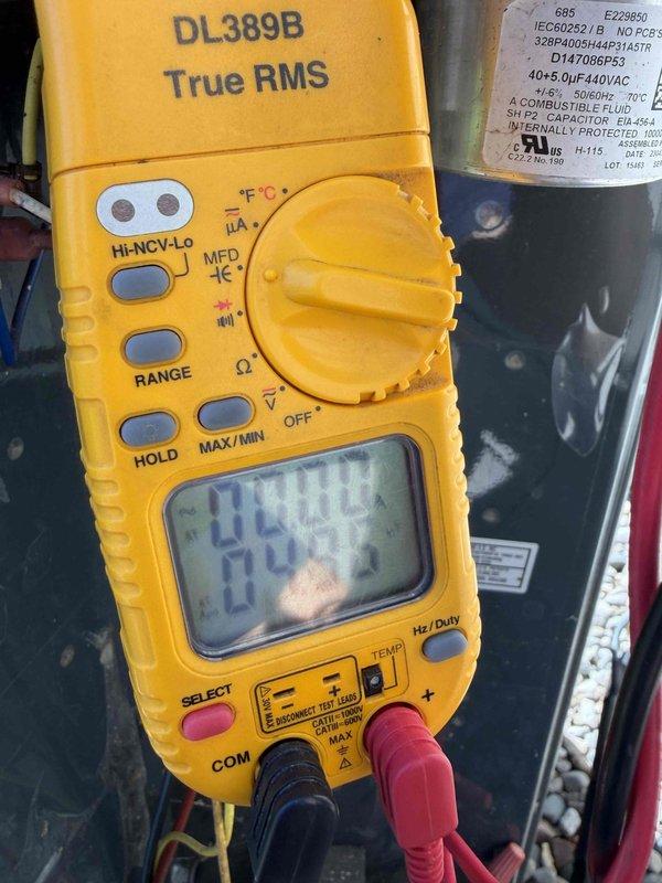 Completed comprehensive cooling system maintenance inspection during scheduled preventative maintenance visit. Performed electrical diagnostics using digital multimeter to verify proper voltage and capacitance readings at terminal connections, ensuring all electrical components were operating within manufacturer specifications. Inspected and documented condition of wiring, terminal blocks, and capacitor assembly, noting normal wear consistent with system age but all components functioning properly.